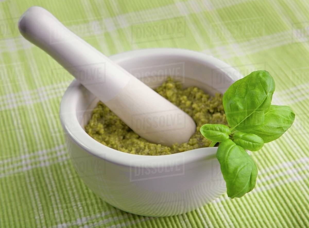 Pesto in mortar Stock Photo Dissolve