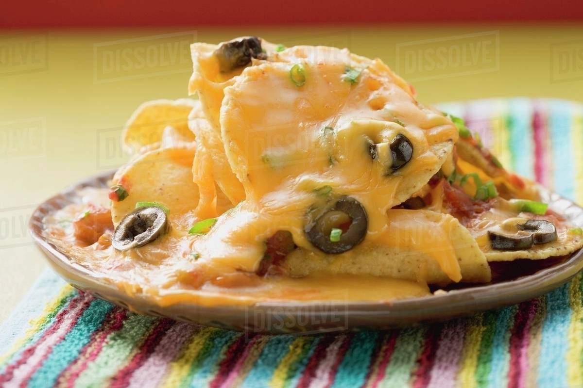 Tortilla chips with melted cheese and olives (Mexico) Stock Photo