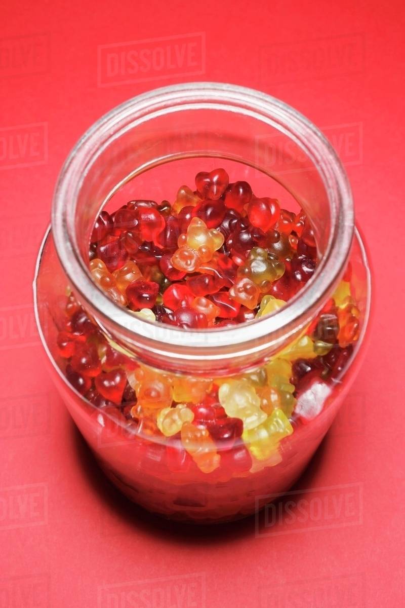 Gummi bears in storage jar - Stock Photo - Dissolve