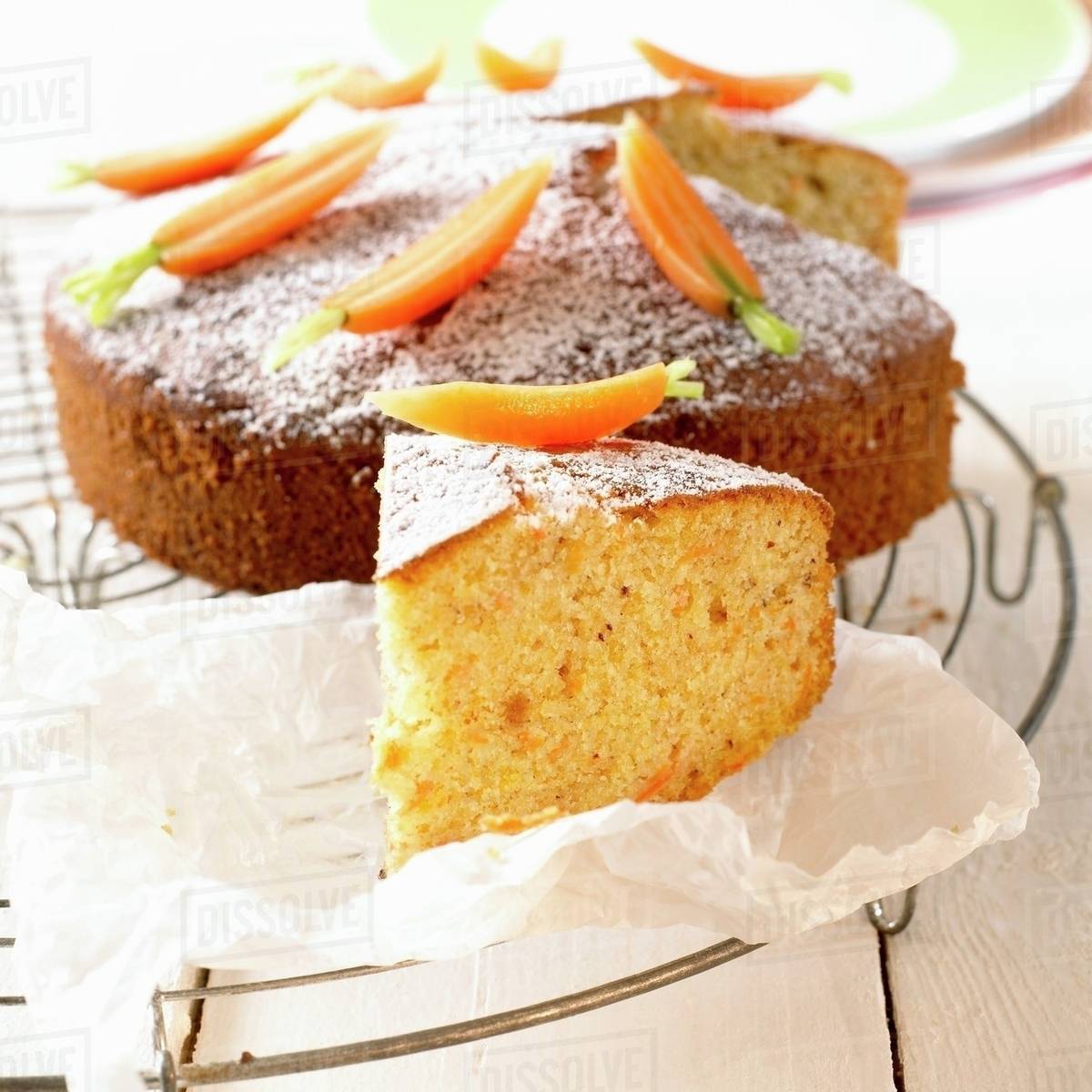 Carrot cake decorated with fresh carrots - Stock Photo - Dissolve