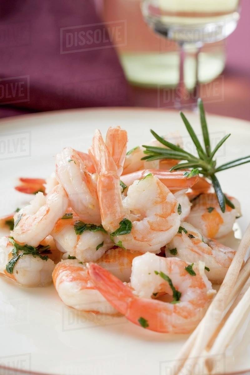 Fried prawns with rosemary and sesame grissini Stock Photo Dissolve