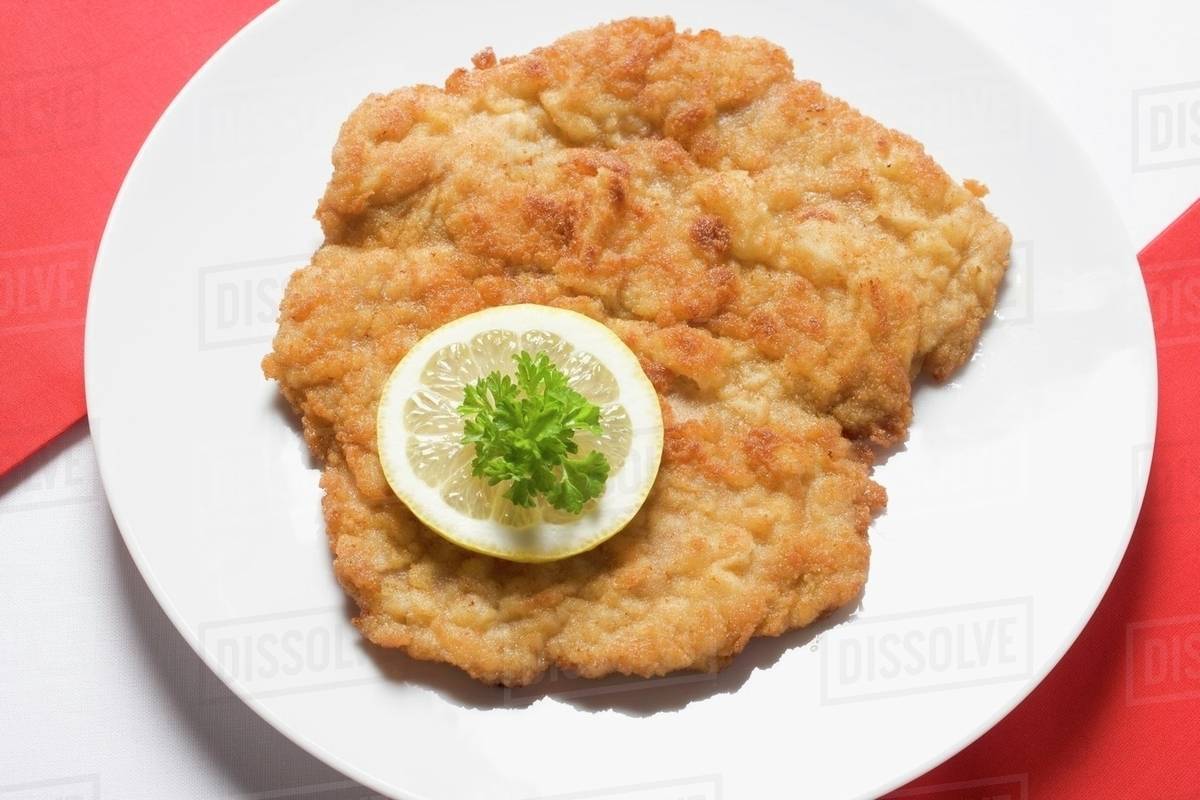 Wiener schnitzel (veal escalope) with lemon slice & parsley Stock