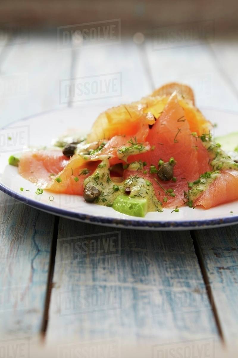 Salmon carpaccio with mustard sauce, capers and dill Stock Photo