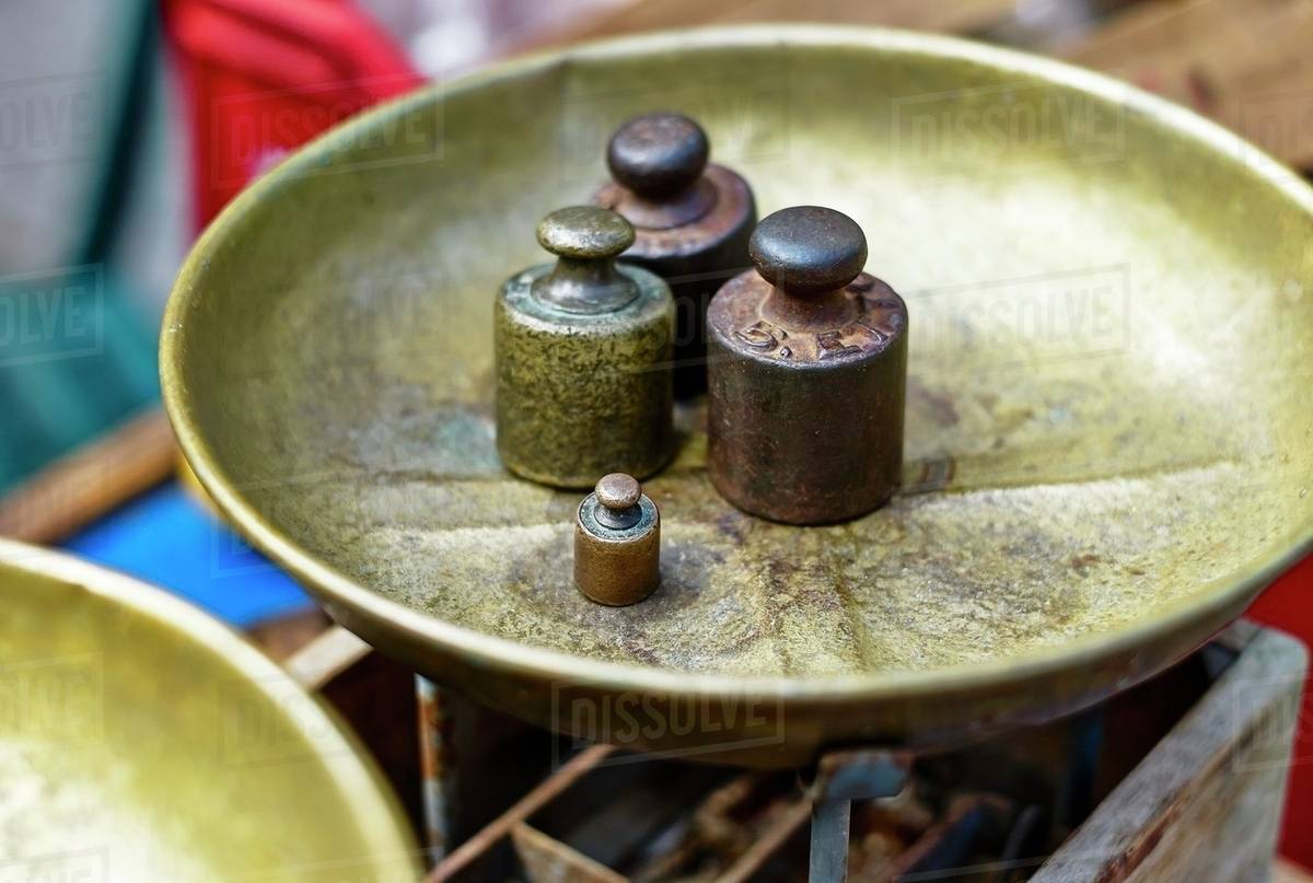Weights on a weighing dish Stock Photo Dissolve