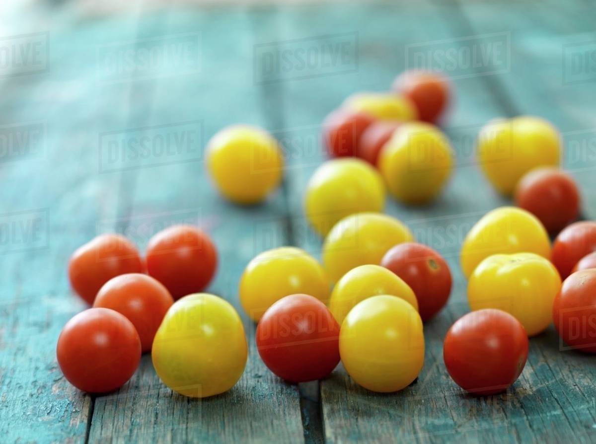 Red and yellow cherry tomatoes Stock Photo Dissolve