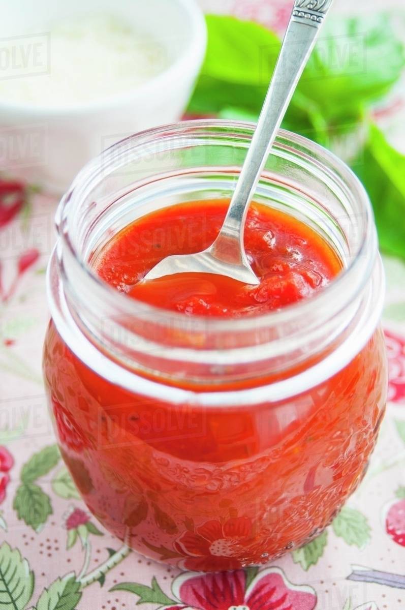 A jar of homemade tomato sauce Stock Photo Dissolve