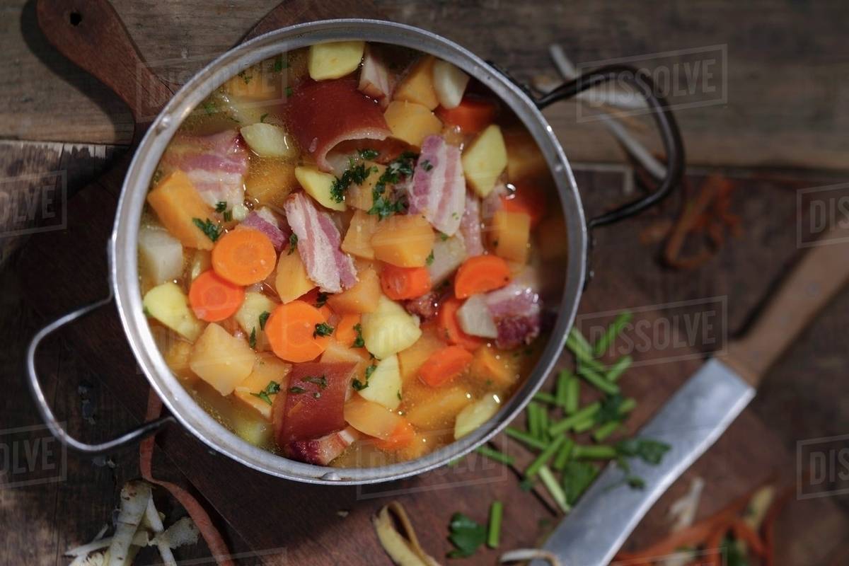 Turnip soup with bacon and carrots Stock Photo Dissolve