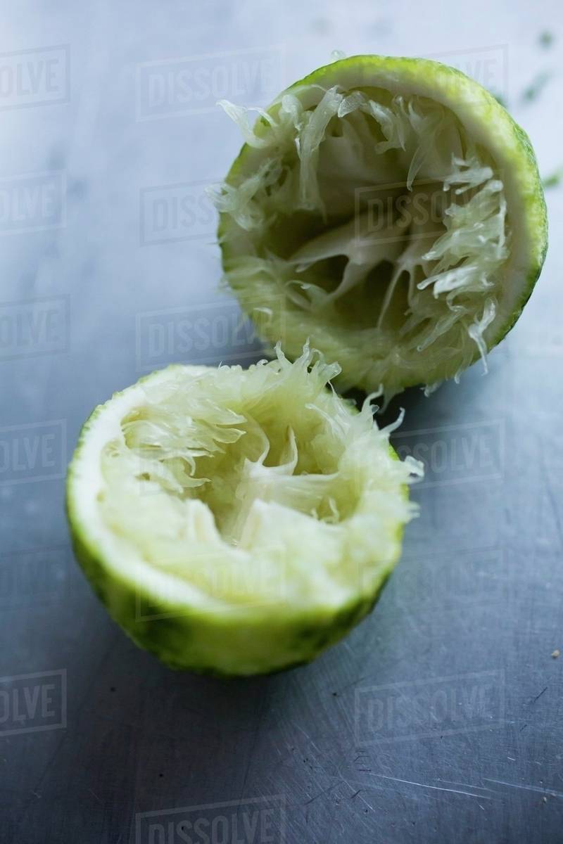 Squeezed lime halves Stock Photo Dissolve