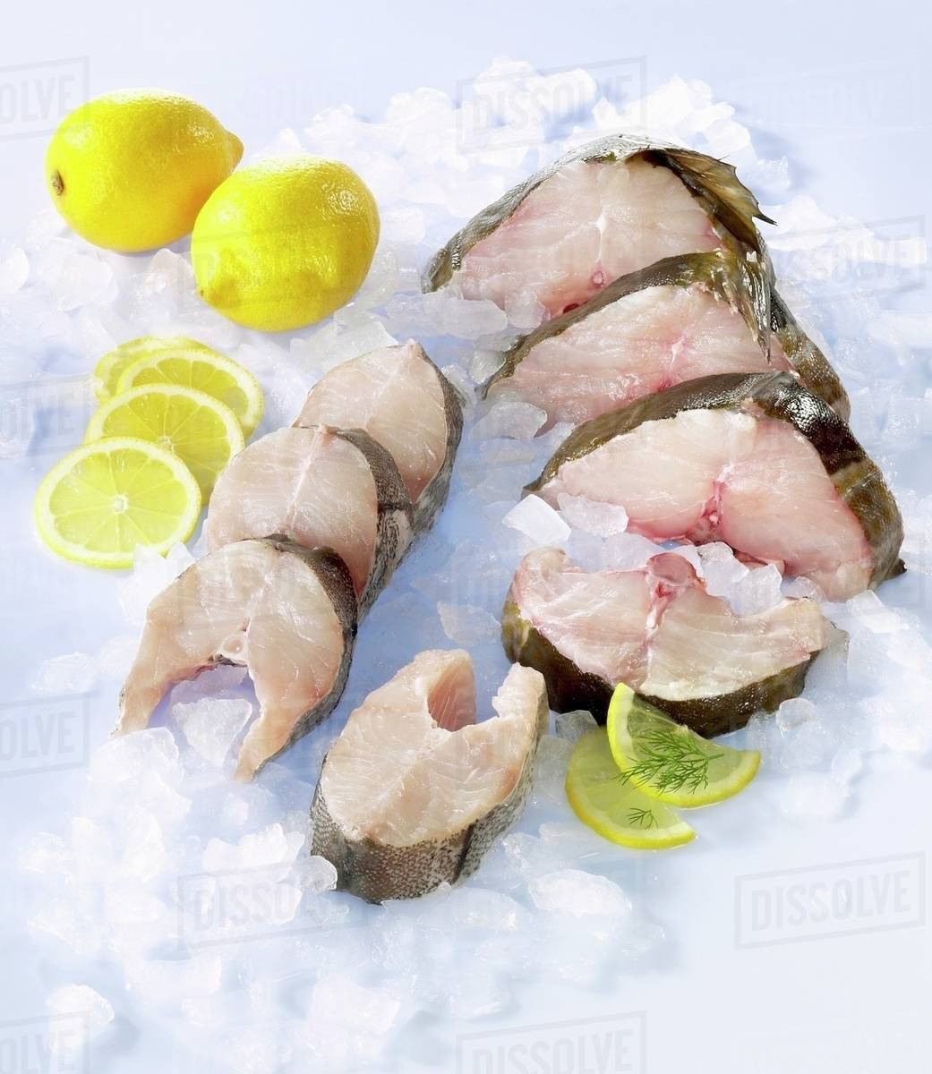 Fresh cod and haddock steaks Stock Photo Dissolve