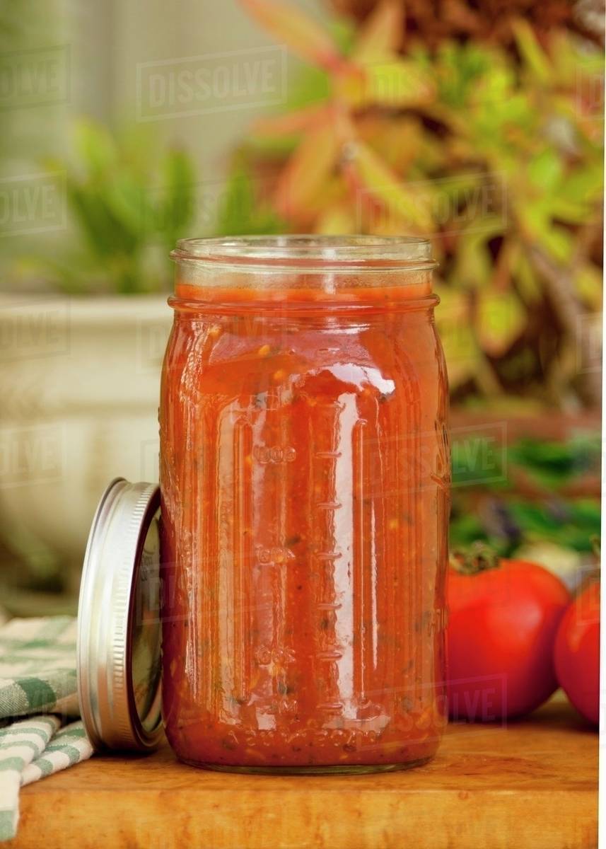 A jar of homemade tomato sauce Stock Photo Dissolve