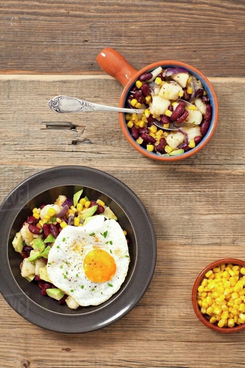 Potato salad with kidney beans, sweetcorn, avocado and fried egg