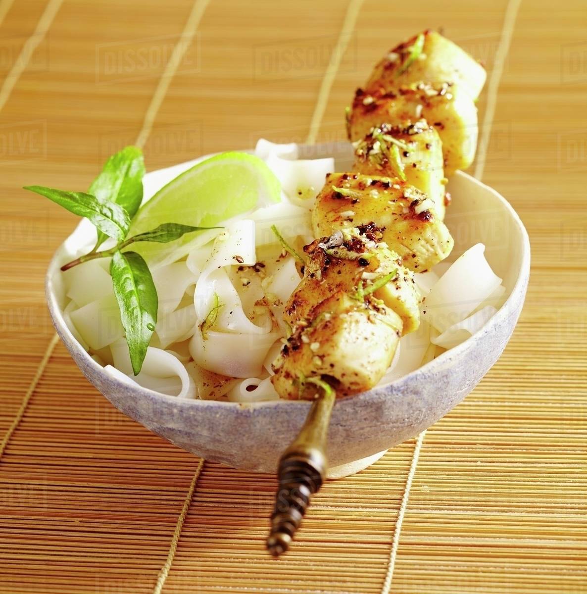 Pepper and coriander chicken on a skewer Stock Photo Dissolve