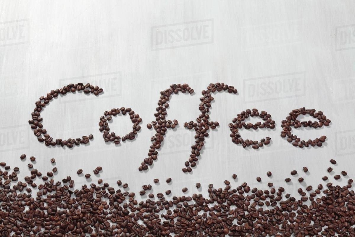 The word coffee written in coffee beans Stock Photo Dissolve