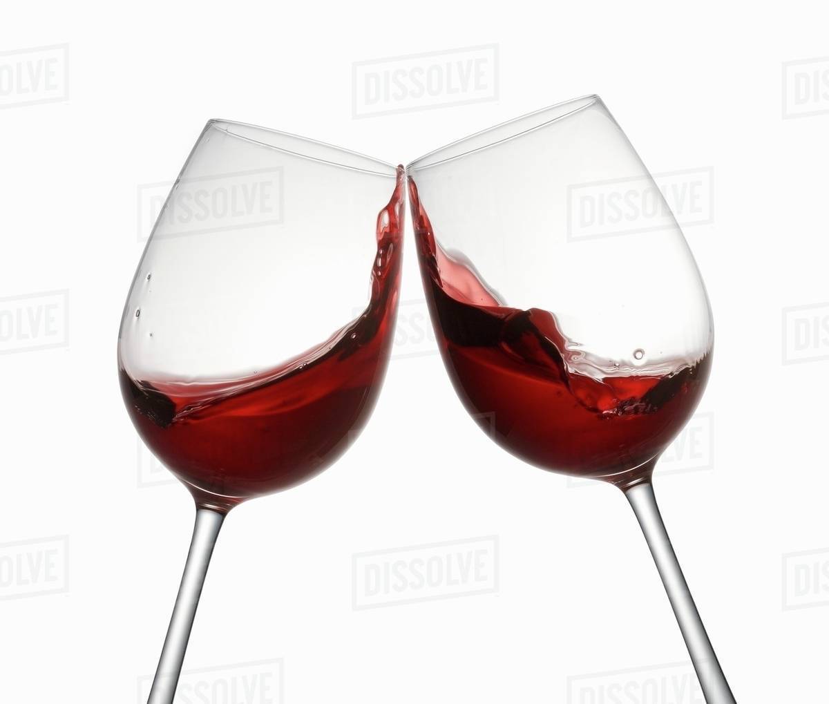 Glasses Of Red Wine Being Clinked Together Stock Photo Dissolve