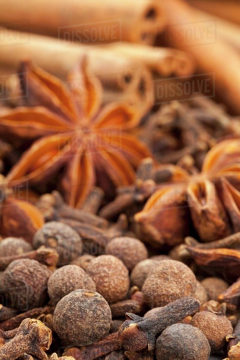 Winter spices (cloves, allspice, star anise, cinnamon) Stock Photo Dissolve