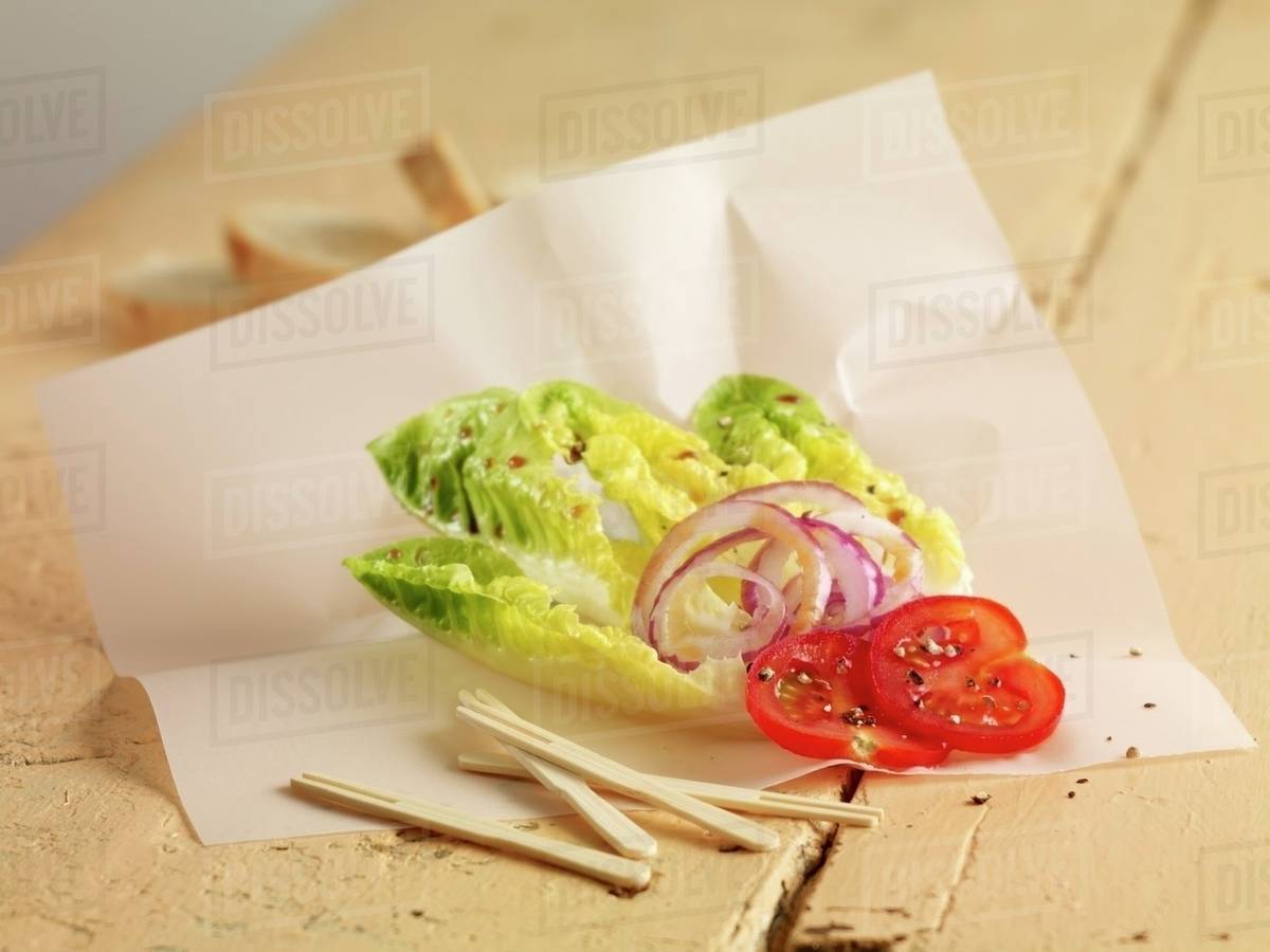 Lettuce hearts with onions and tomatoes Stock Photo Dissolve