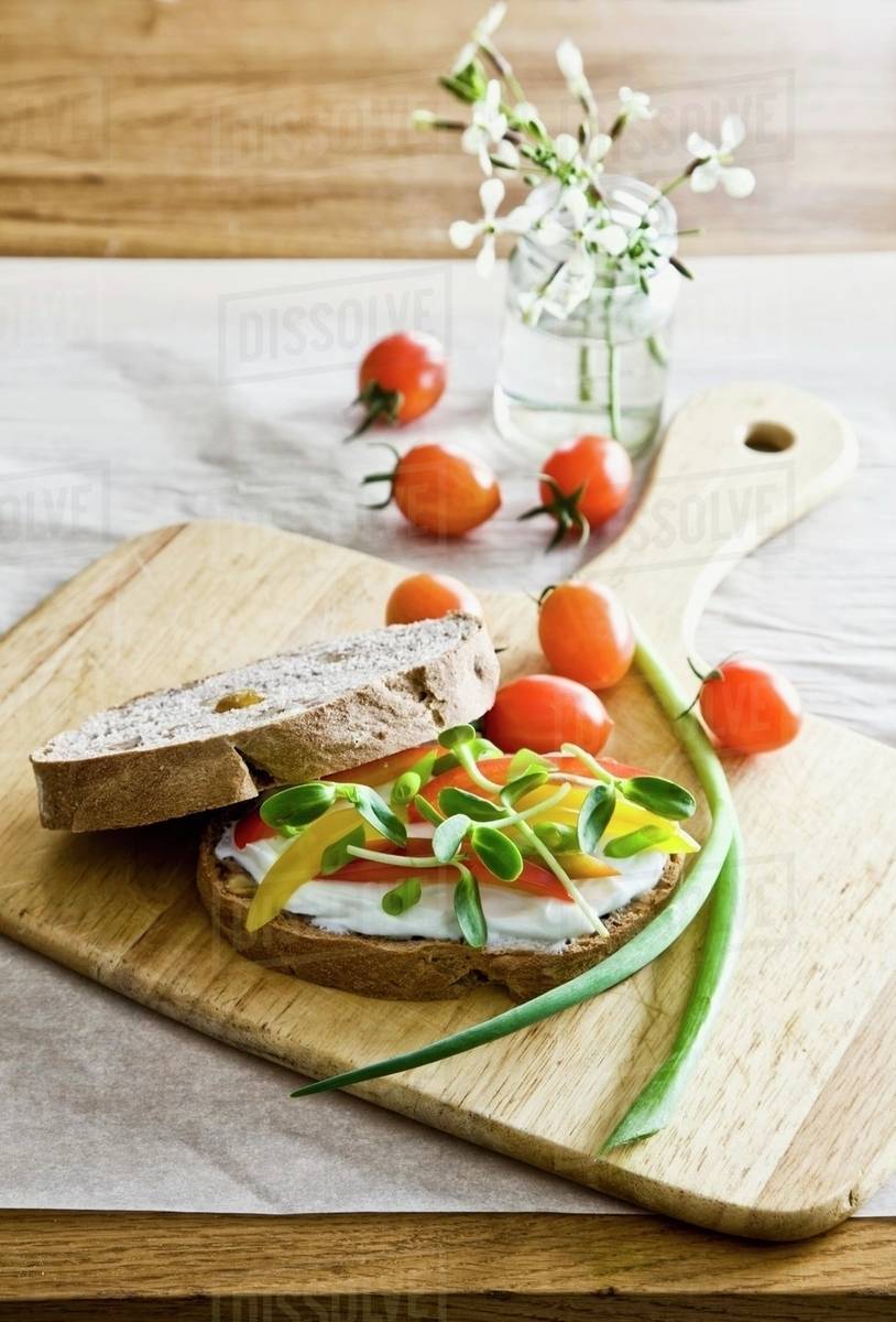 Sandwich with cream cheese, pepper and sprouts Stock Photo Dissolve