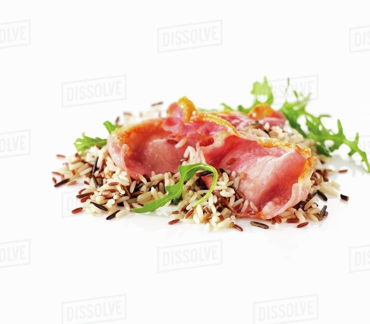 Wild rice salad with bacon and rocket Stock Photo Dissolve
