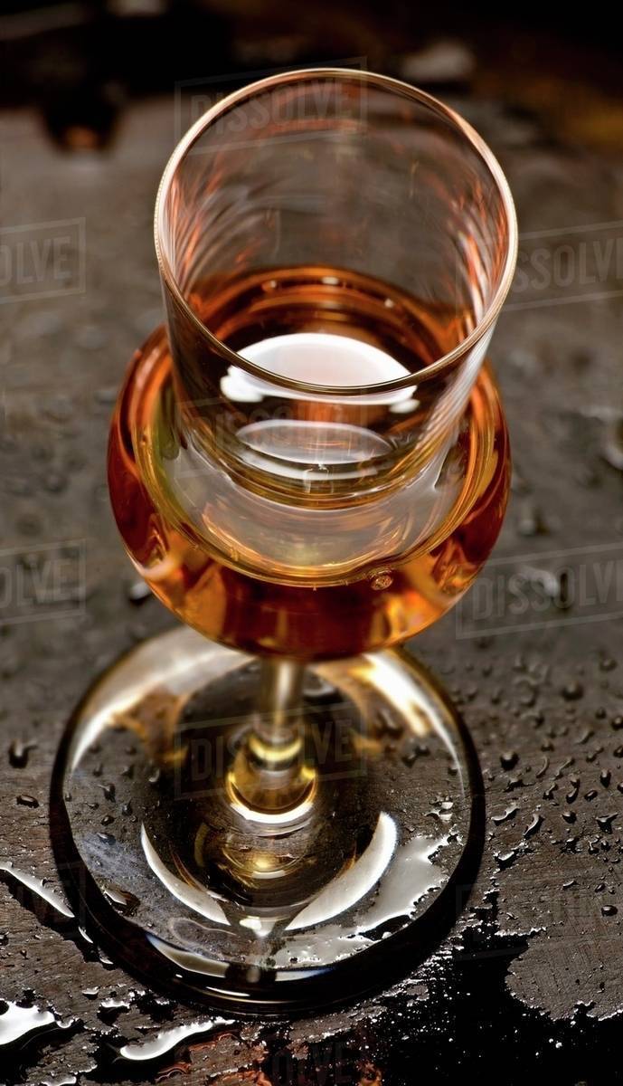 Grappa in a glass - Stock Photo - Dissolve