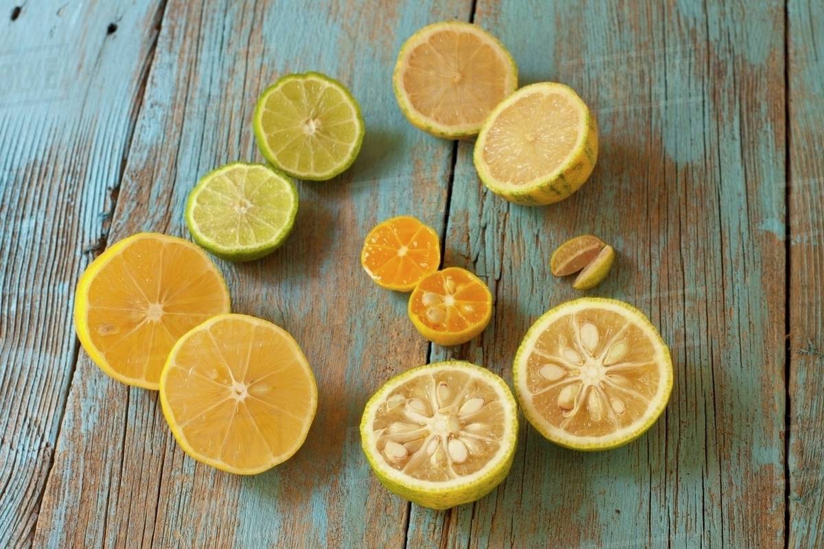 Assorted Citrus; Meyer Lemon, Yuzu, Finger Limes, Calamondin, Kaffir Lime, Variegated Pink Lemon Royalty-free stock photo