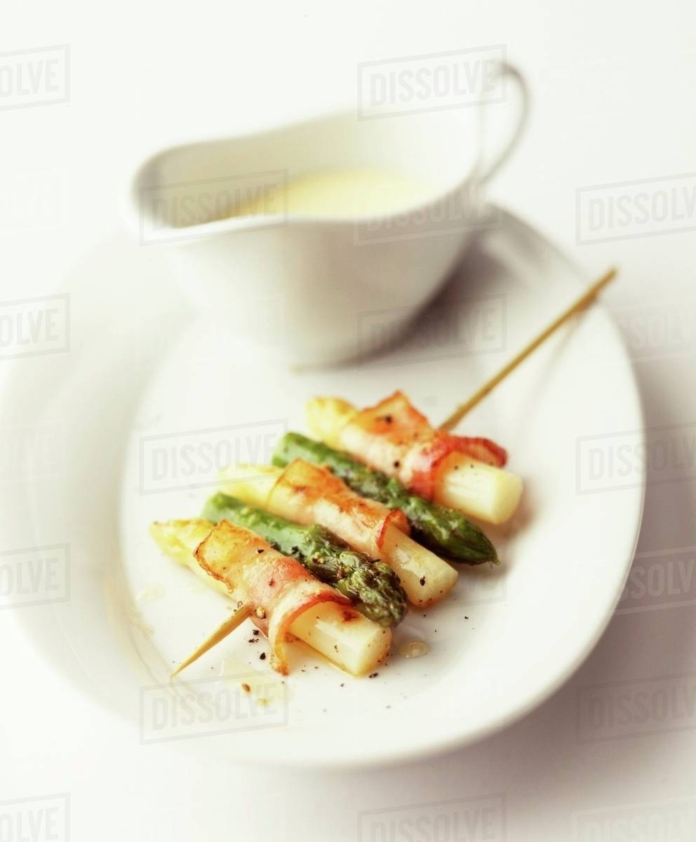 Asparagus skewers with bacon Stock Photo Dissolve