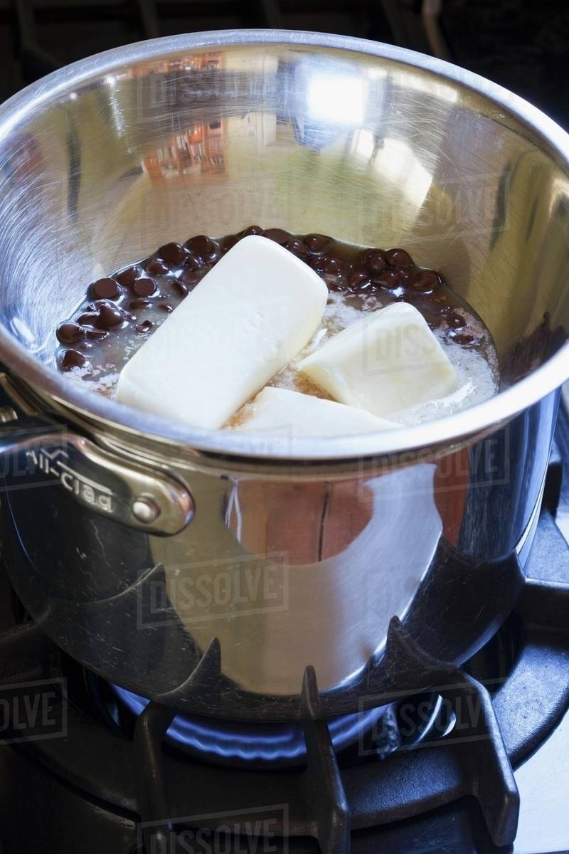 Melting Butter and Chocolate Chips on the Stove Stock Photo Dissolve