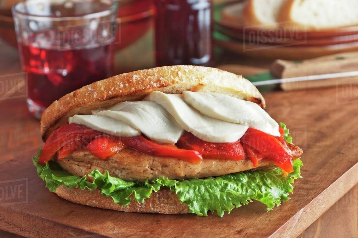 Grilled Chicken Breast Sandwich with Roasted Red Peppers, Mozzarella Cheese and Lettuce on