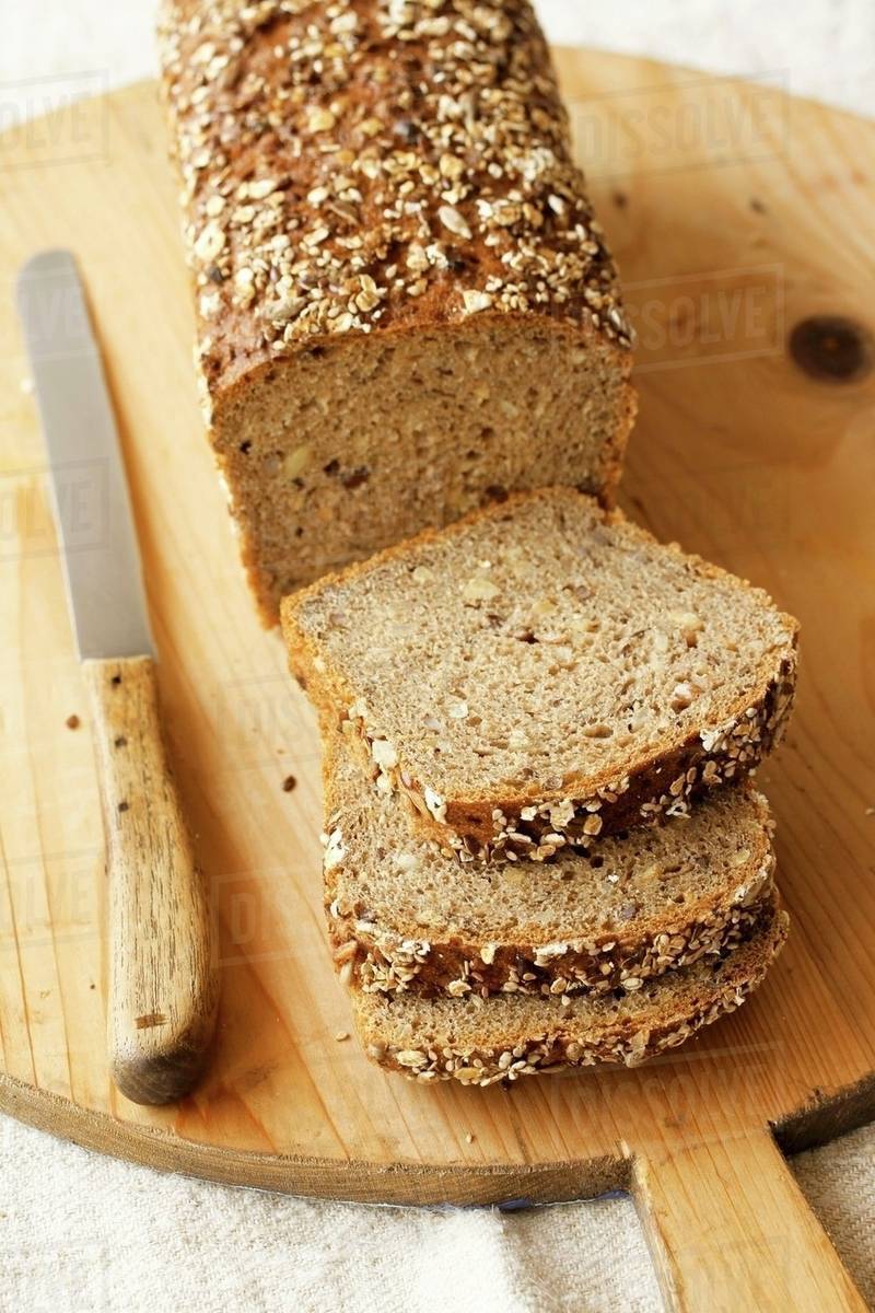 Wholemeal bread, sliced Stock Photo Dissolve