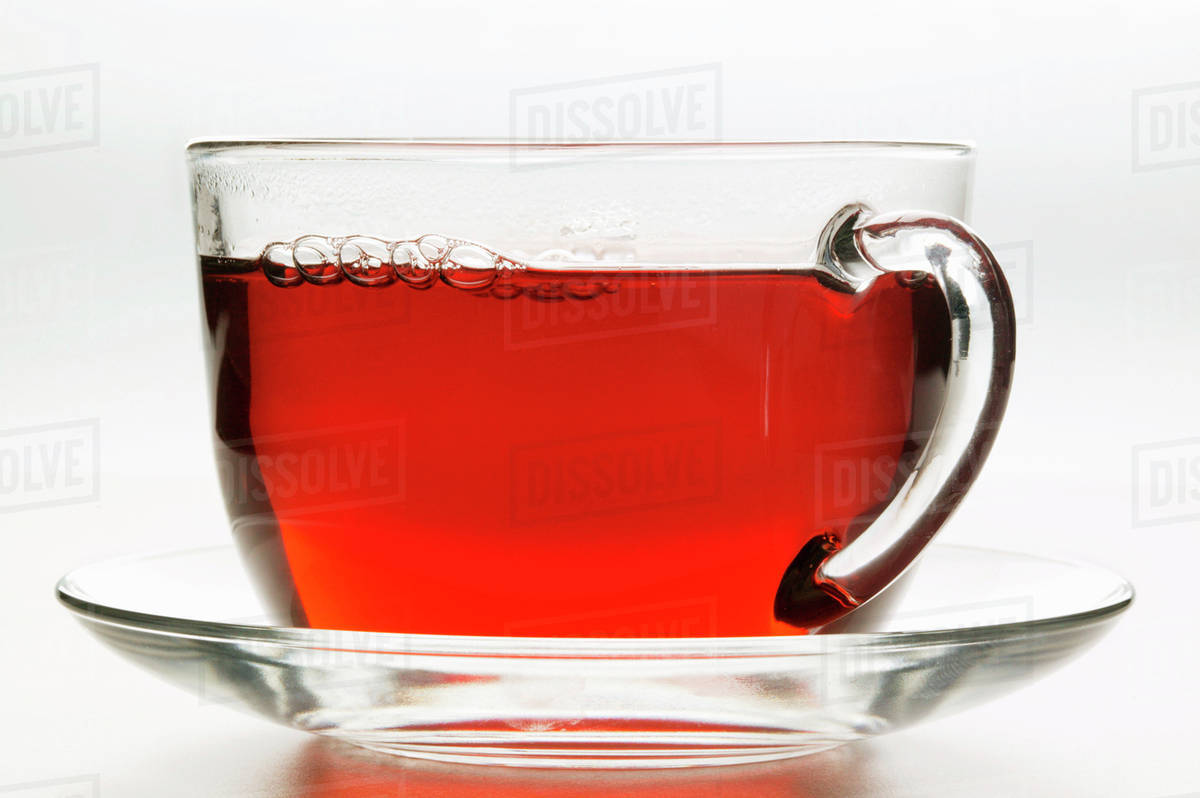 Hot hibiscus tea in glass cup Stock Photo Dissolve