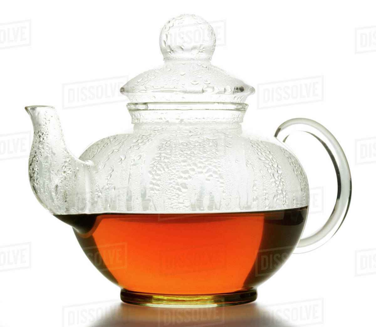 Hot fruit tea in glass teapot Stock Photo Dissolve