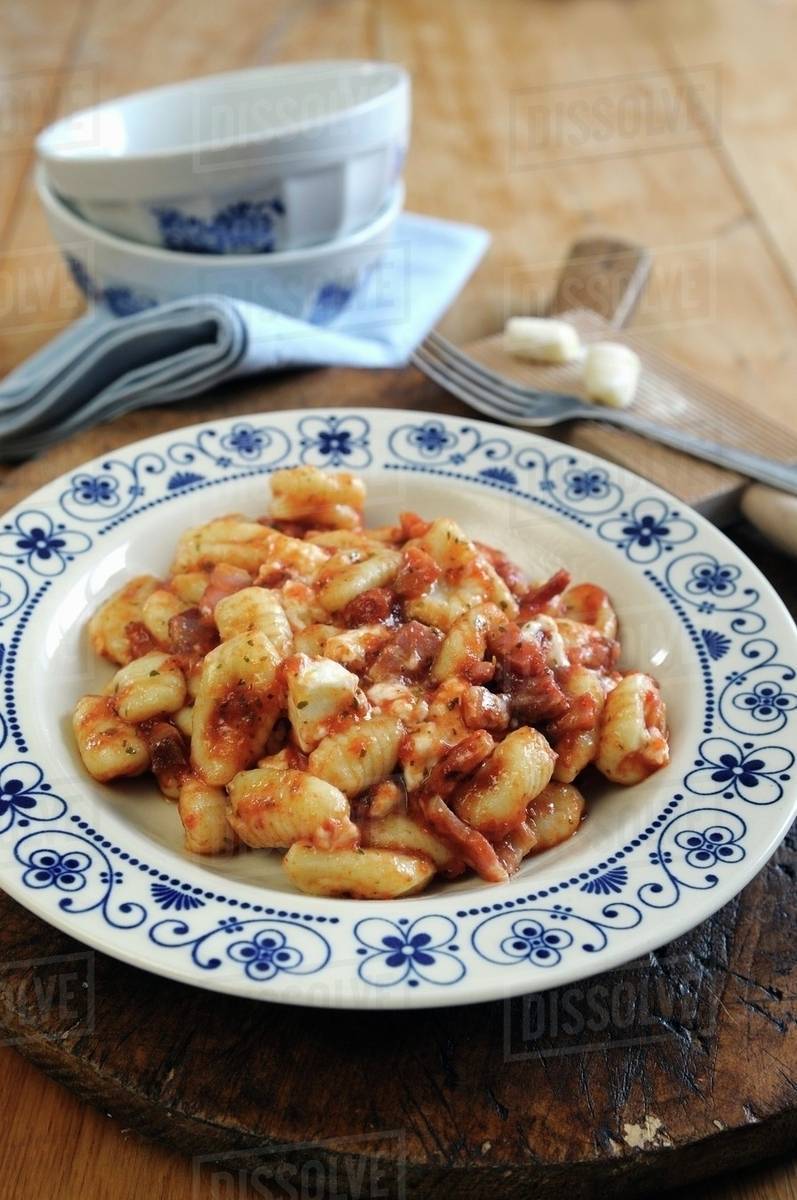 Gnocchi with a tomato, pancetta and taleggio cheese sauce Stock Photo