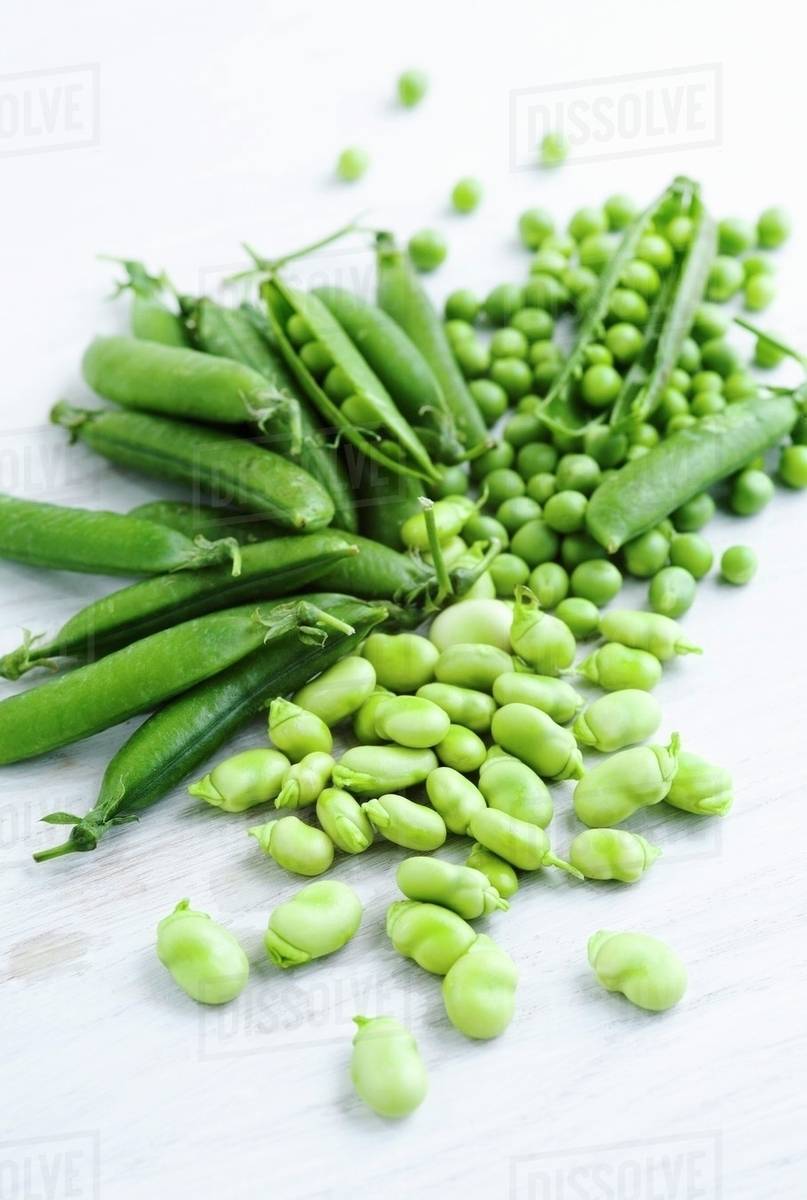 Young peas and fava beans Stock Photo Dissolve