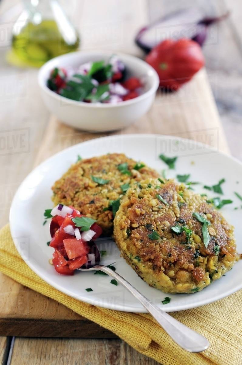 Panfried chickpea cakes spiced with cumin and coriander with fresh