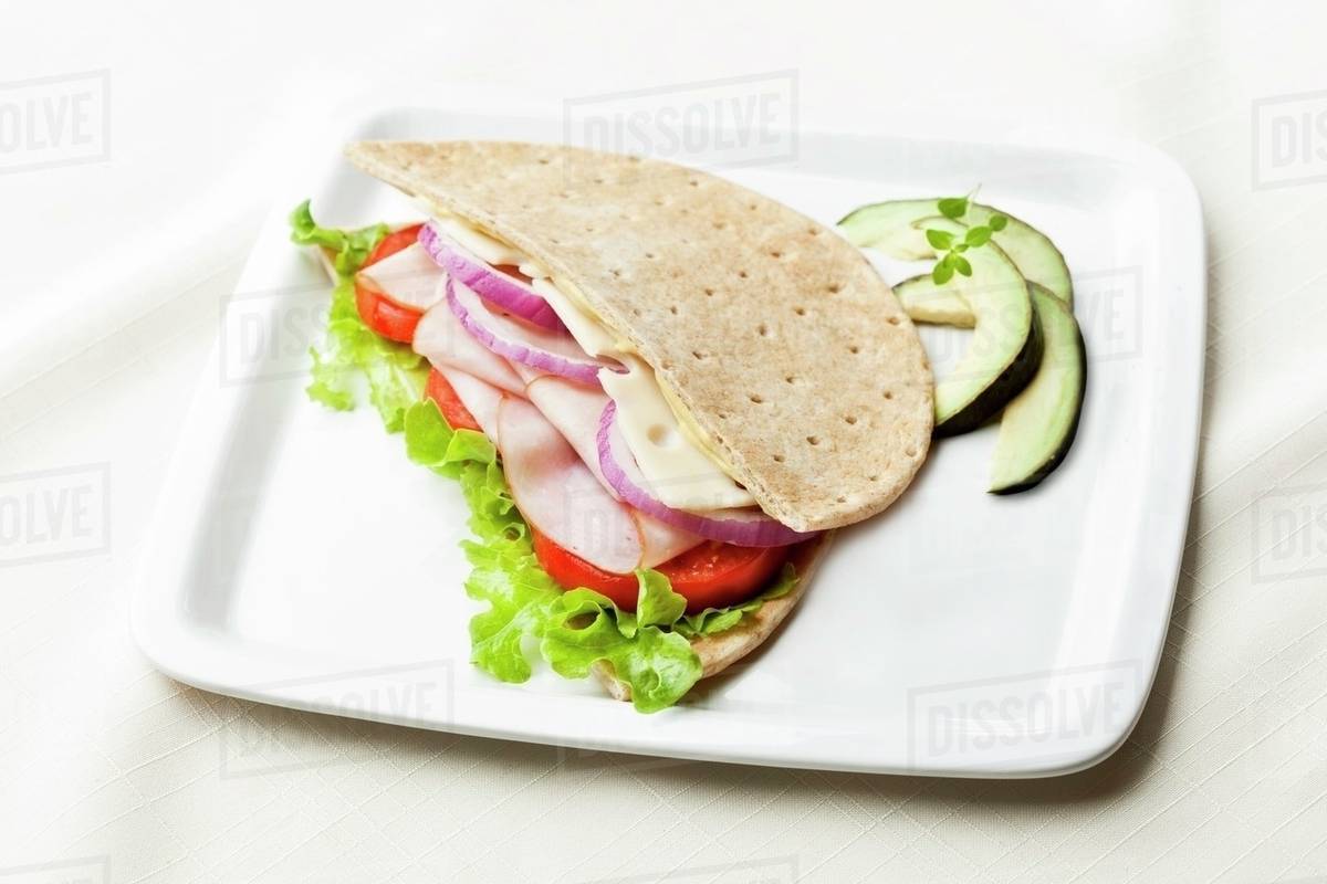 Turkey and Swiss Cheese Sandwich on Flatbread Stock Photo Dissolve