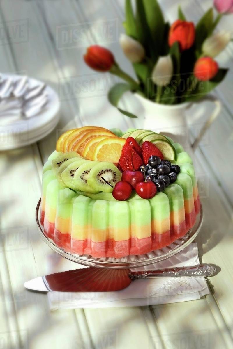 An ice cream cake with fresh fruit Stock Photo Dissolve