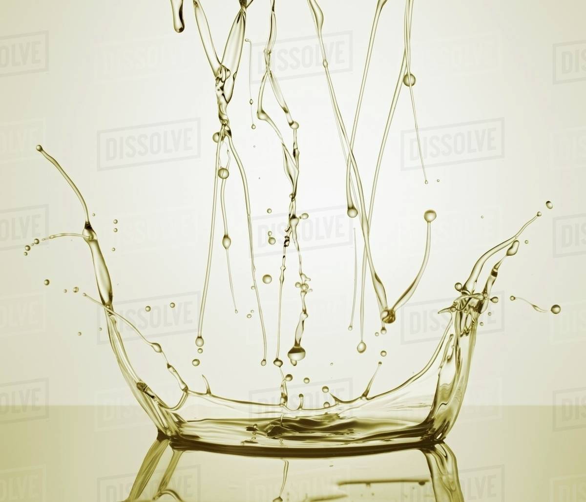 A splash of oil Stock Photo Dissolve