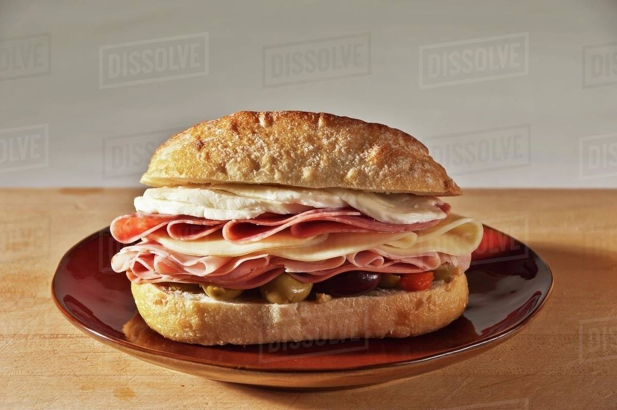Muffaletta Sandwich with Ham, Mortadella, Provolone, Mozzarella, Genoa