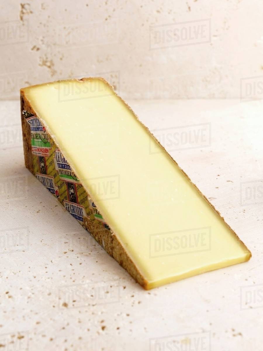 A slice of Gruyere Stock Photo Dissolve