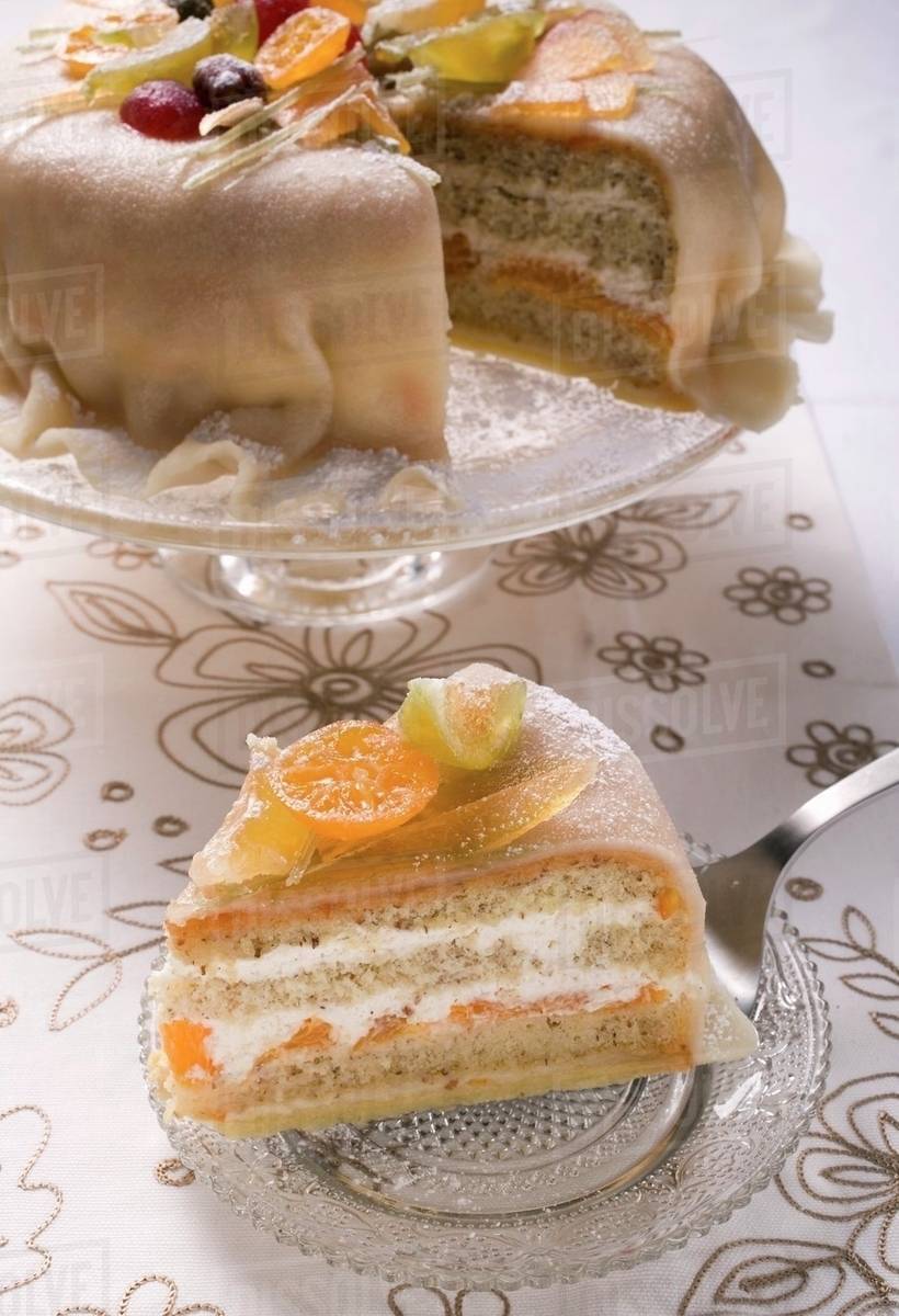 Marzipancovered cake with candied fruit Stock Photo Dissolve