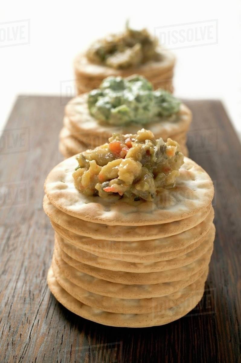 Crackers with three different spreads Stock Photo Dissolve