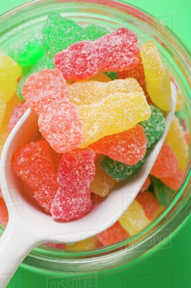 Sour Sweets (fruity jelly sweets, USA) in storage jar Stock Photo