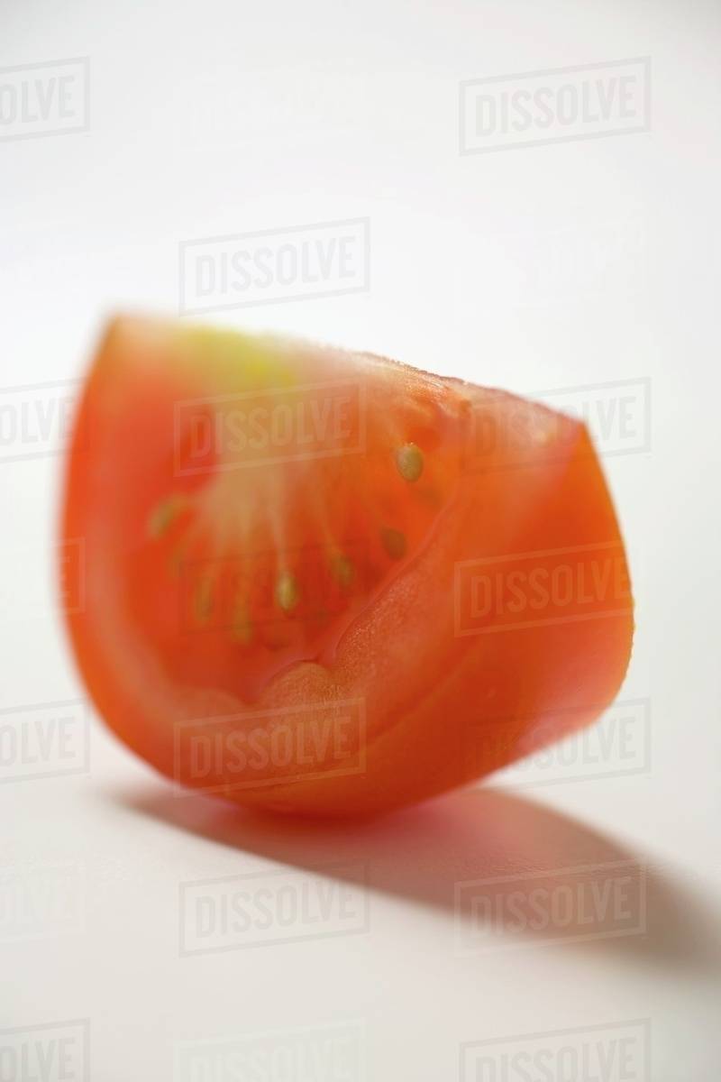 A tomato wedge Stock Photo Dissolve