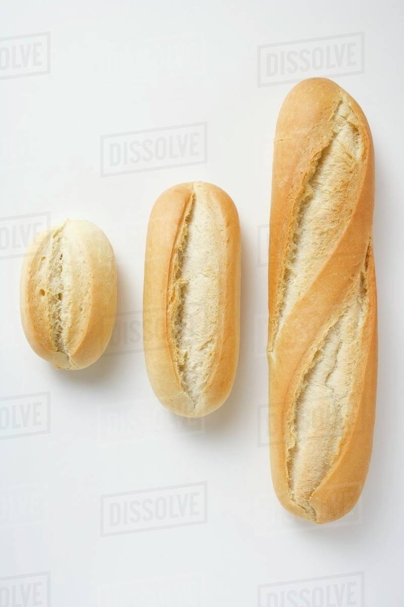 Baguette rolls of different sizes Stock Photo Dissolve