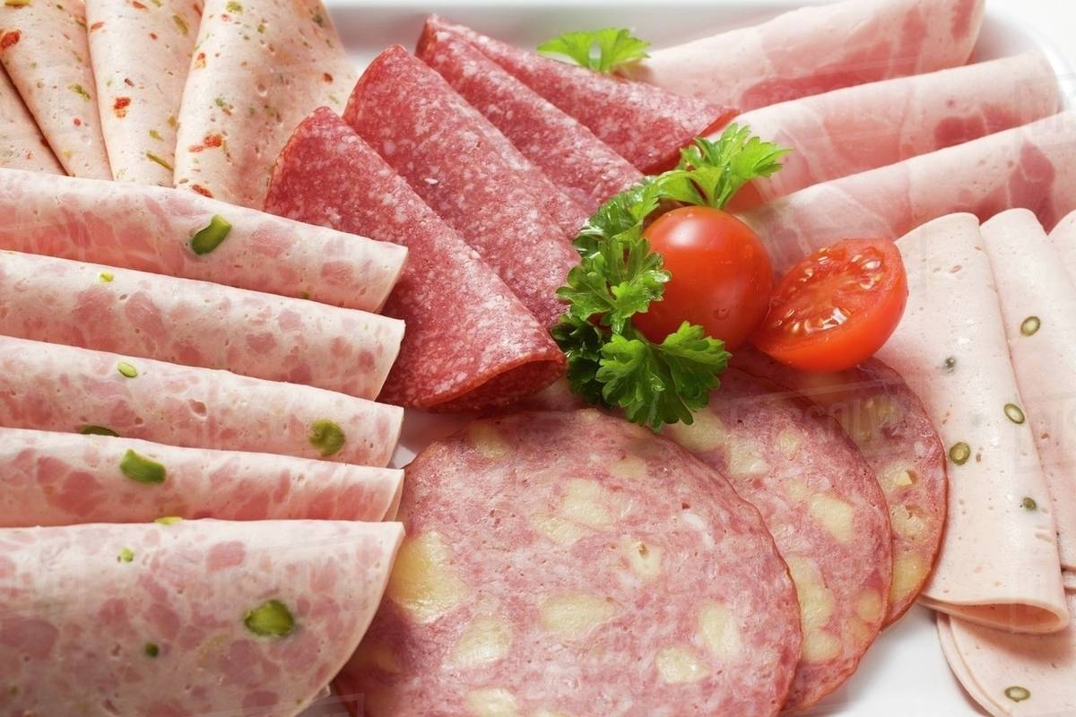 Cold cuts platter with cherry tomatoes and parsley Stock Photo Dissolve