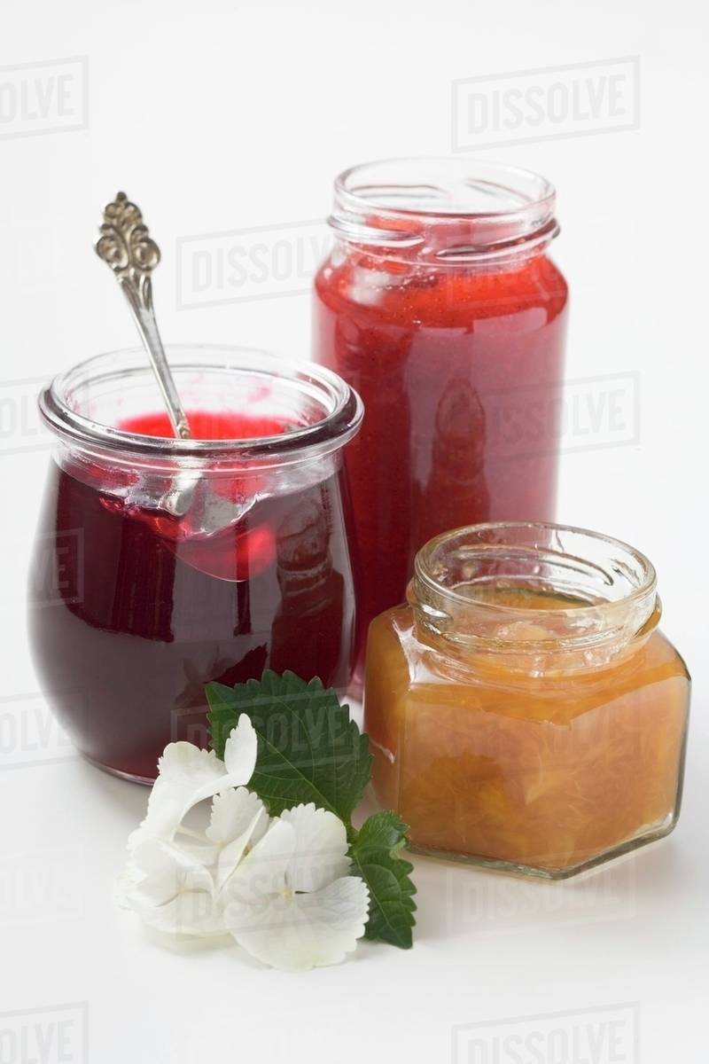 Three different jars of jam Stock Photo Dissolve