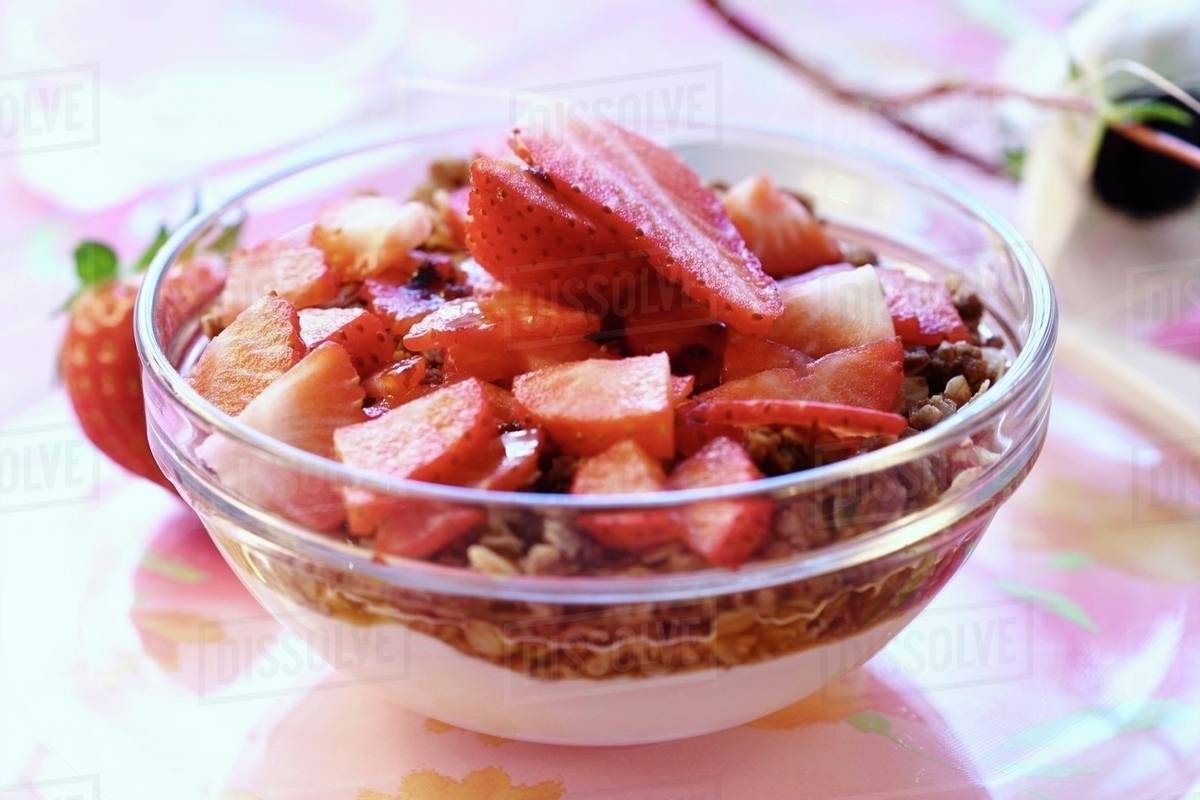 Muesli with rolled oats and strawberries Stock Photo Dissolve