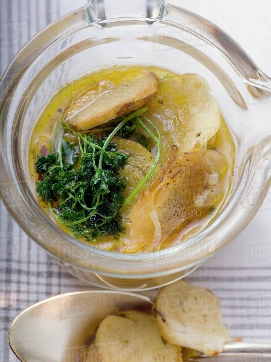 Pretzel soup with onions and deepfried parsley Stock Photo Dissolve