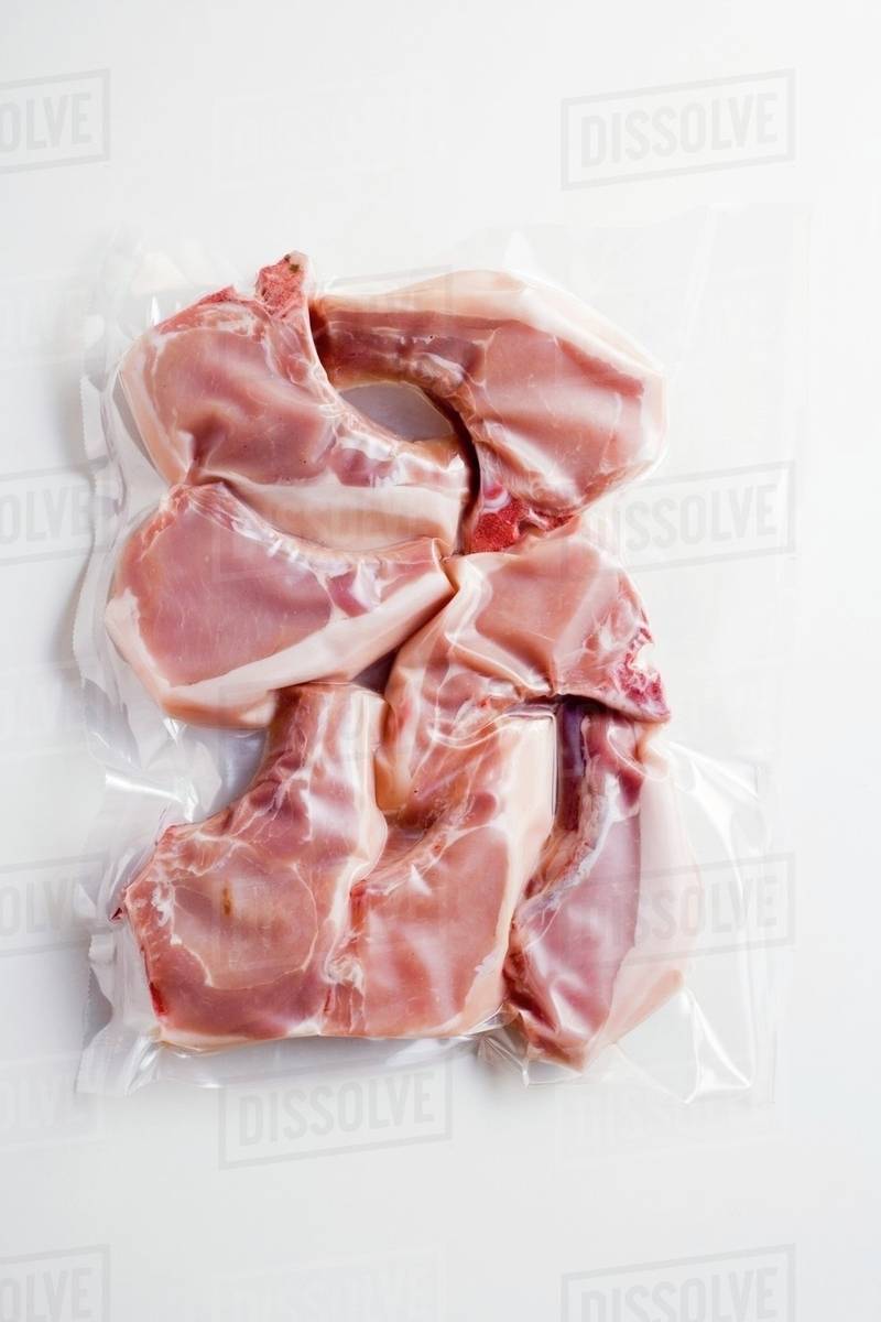 Pork chops, vacuum packed Stock Photo Dissolve
