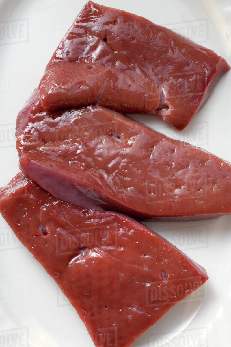 Three slices of calf's liver Stock Photo Dissolve