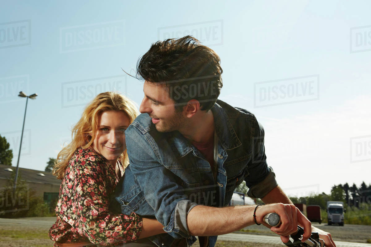 Germany, Dusseldorf, Young couple riding bicycle Royalty-free stock photo